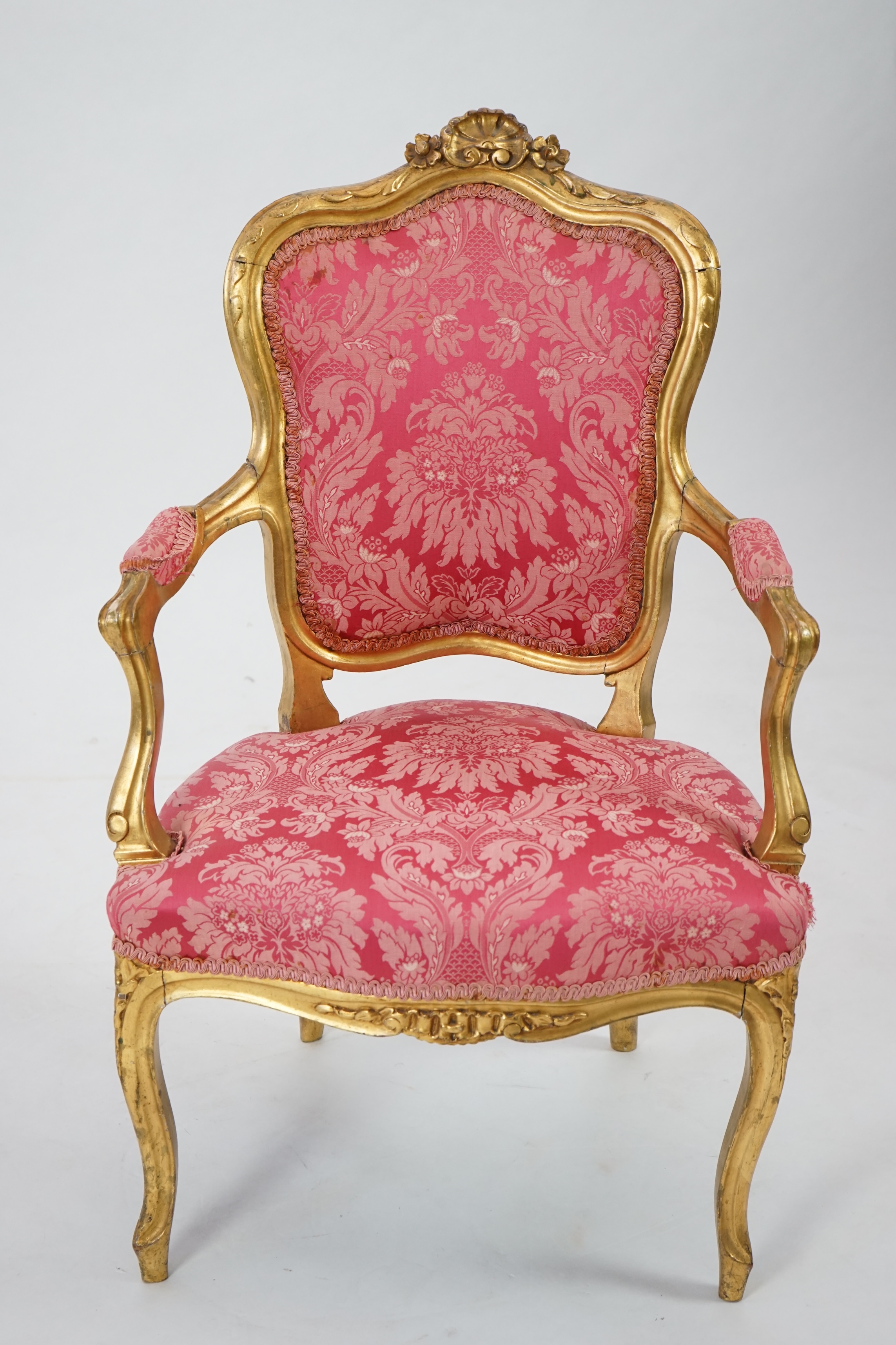 A Louis XV style carved giltwood fauteuil